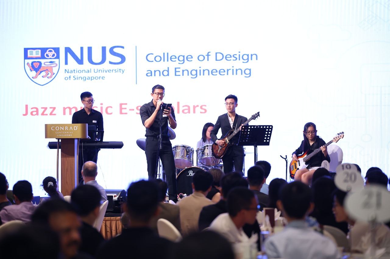 Shan Yuxuan singing with a jazz band at an NUS College of Design and Engineering event